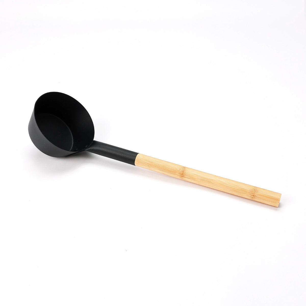 Close-up of All Day Sauna Co. ladle — designed for controlled steam infusion over sauna rocks