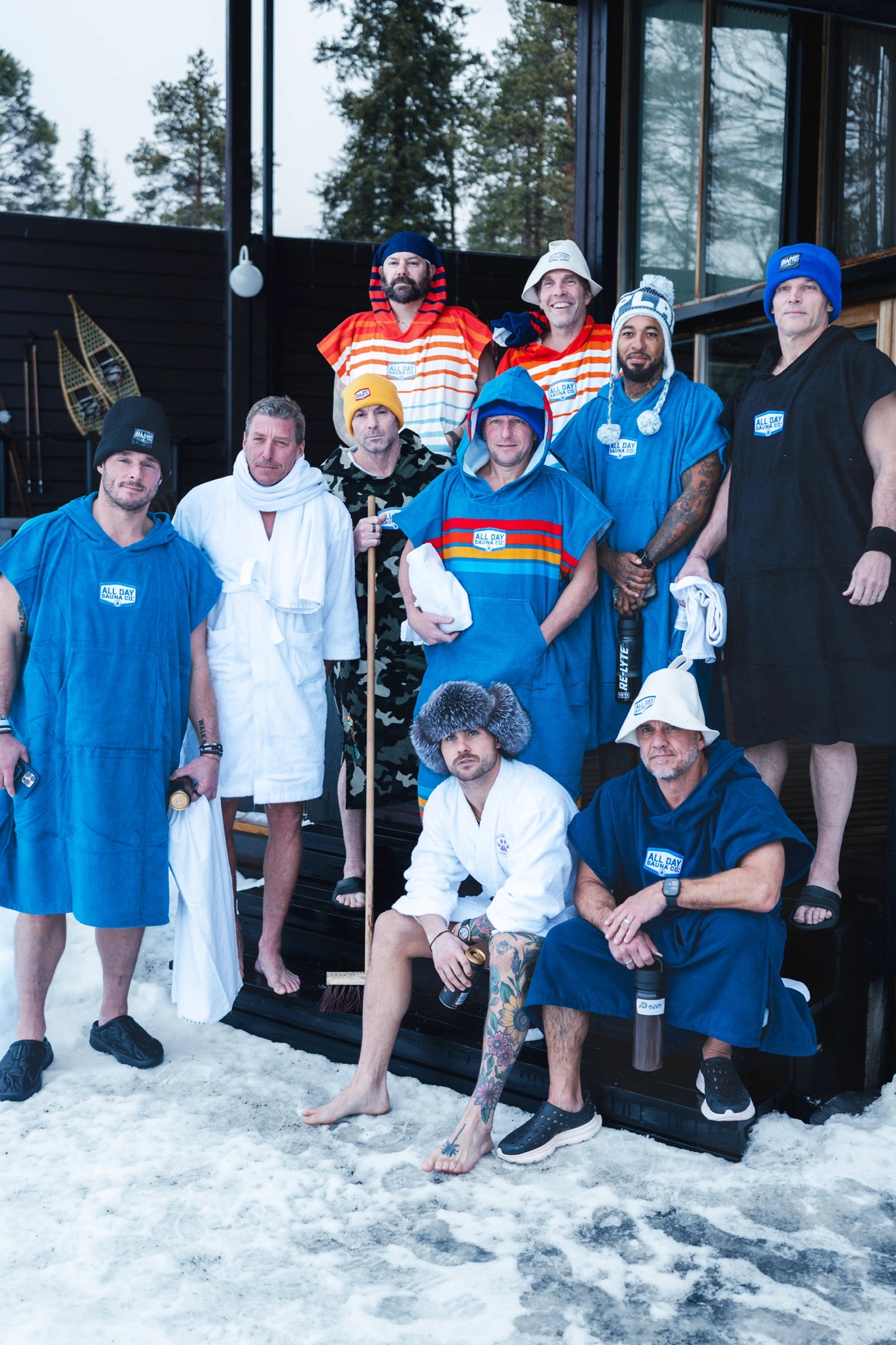 Group of sauna users wearing colorful All Day Sauna Co. robe — ideal pre- and post-sauna coverage with moisture-wicking comfort