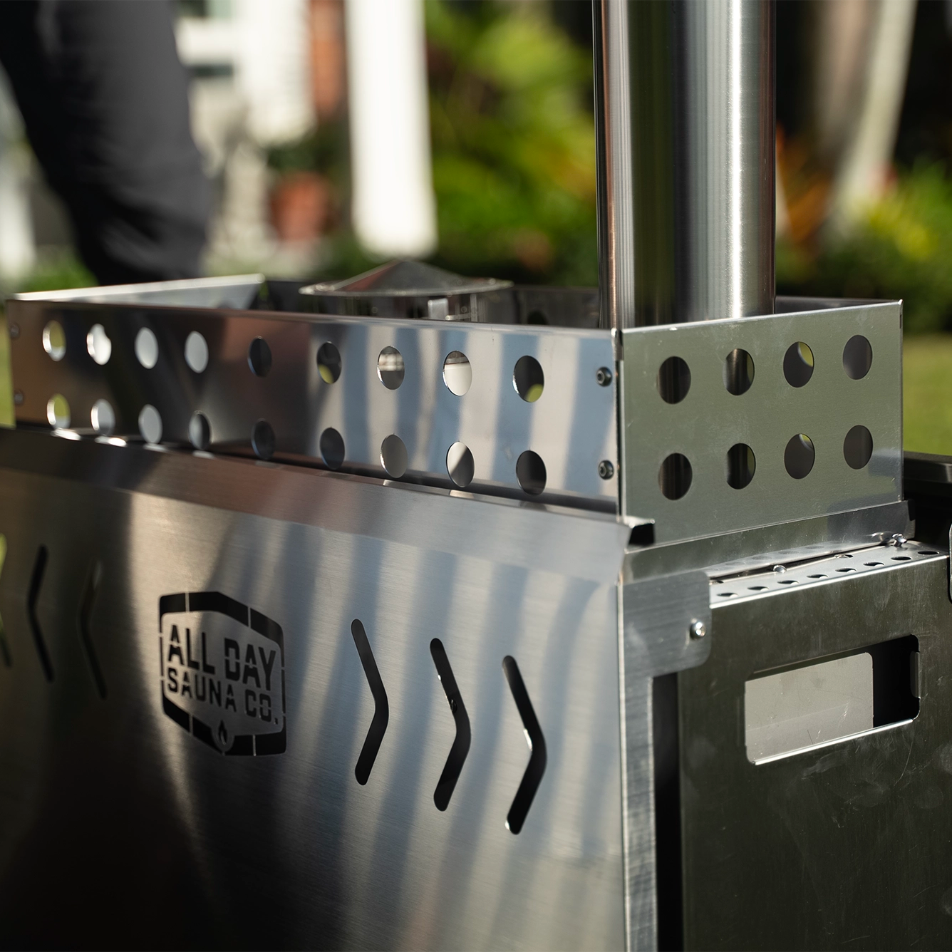 Close up of All Day Sauna Co. stainless steel wood burning stove.