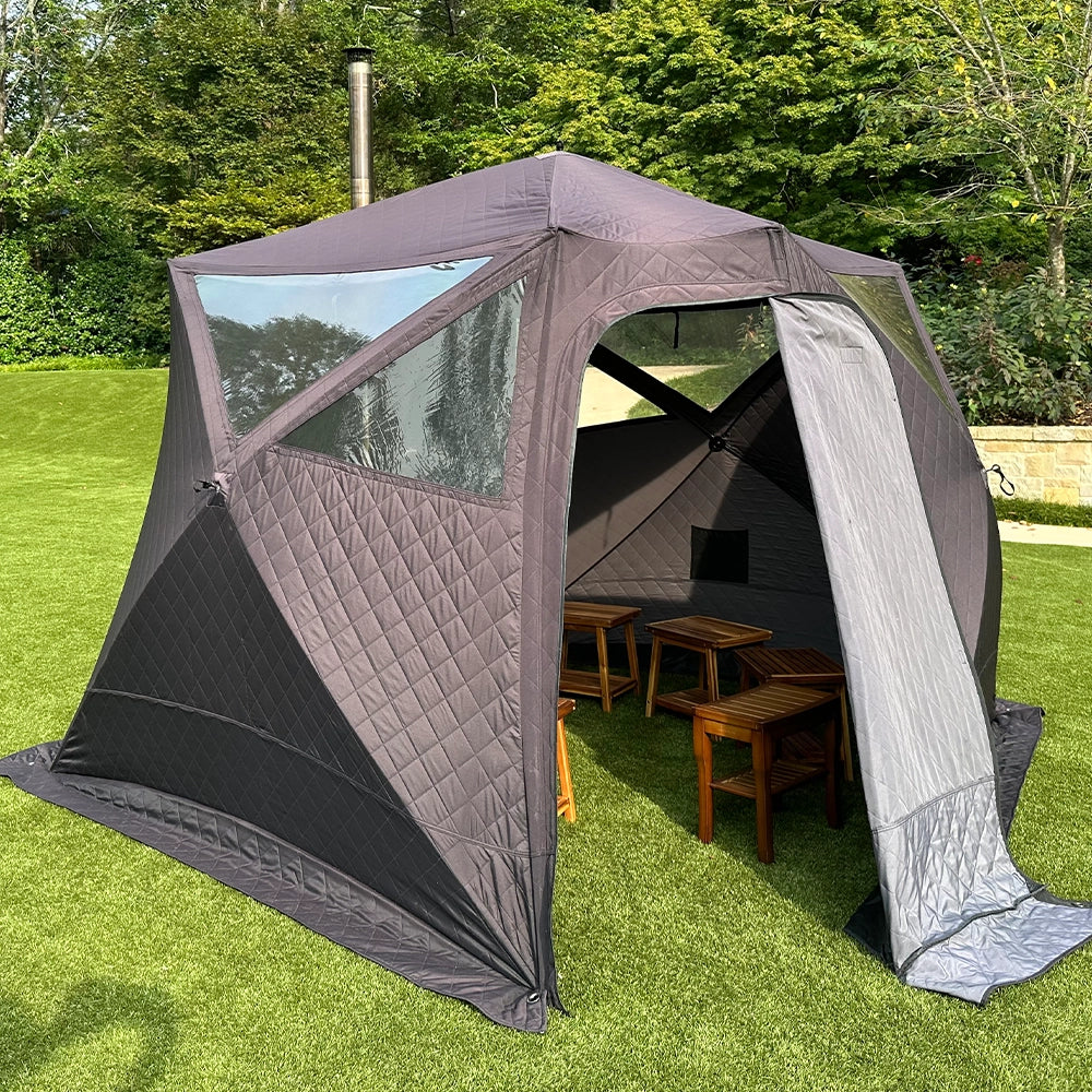 All Day Sauna Co. 6‑person outdoor sauna tent with included wood‑stove — black fire‑resistant fabric, chimney vent up top, shown on turf