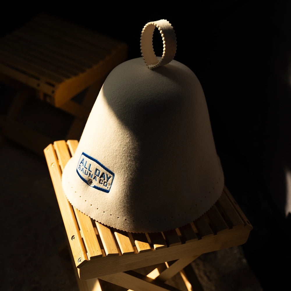Close-up of All Day Sauna Co. wool sauna hat detailing — felt wool material and embroidered logo